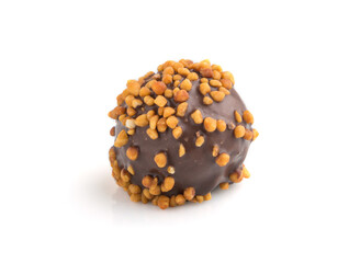 Chocolate caramel ball candy with almonds isolated on white background. Side view.