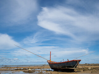 Small fishing boats of villagers in the area parked on Phla beach, Rayong province after going out...