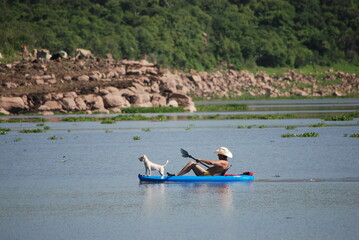 man and woman kayaking in the river
