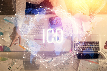 Double exposure of man and woman working together and crypto theme hologram drawing. Computer background. Blockchain concept. Top View.