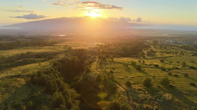 View of mountain. Maui Hawaii island seen from above. Summer vacation travel in America. Sunset light. Drone aerial shot 4k.
