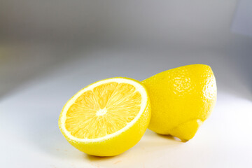 Lemon sliced into half isolated; yellow juicy lemon half isolated