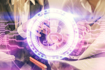 Double exposure of man and woman working together and crypto finance theme hologram. Blockchain business concept. Computer background.