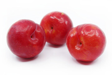 Plums isolated on a white background. Fresh plum. Closeup