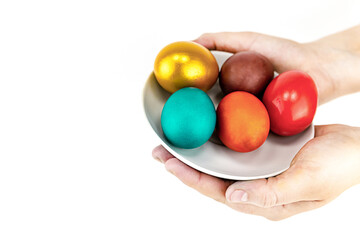 Easter bright painted eggs festive set in the hands of an isolated background base