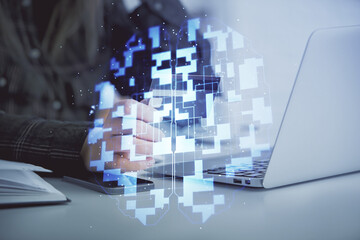 Double exposure of woman on-line shopping holding a credit card and data theme hologram drawing. E-commerce concept.