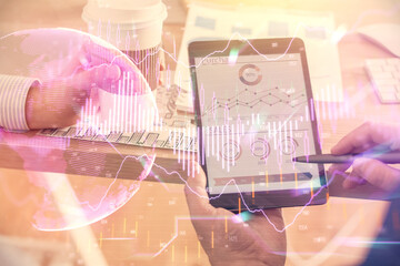 Double exposure of man's hands holding and using a phone and financial chart drawing. Market analysis concept.