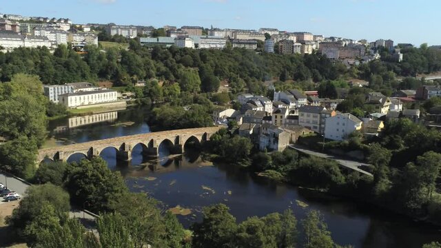 Roman bridge in Lugo, historical city of Galicia,Spain. Aerial Drone Footage