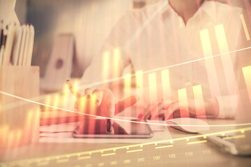 Double exposure of forex chart sketch hologram and woman holding and using a mobile device. Financial market concept.