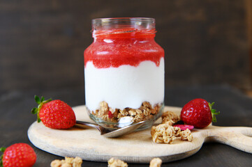 Healthy breakfast. Natural strawberry yoghurt. Selective focus.