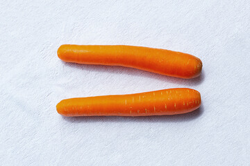 Naklejka premium Red carrot root autumn vegetable. Harvest clean fresh tasty on a white background