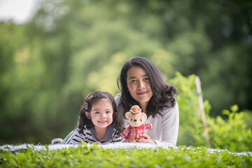 Fototapeta premium Portrait girl child and mother woman