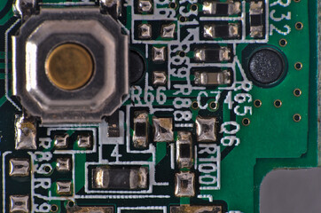 Green Circuit board, components and wires, macro photograph. Science and technology themes