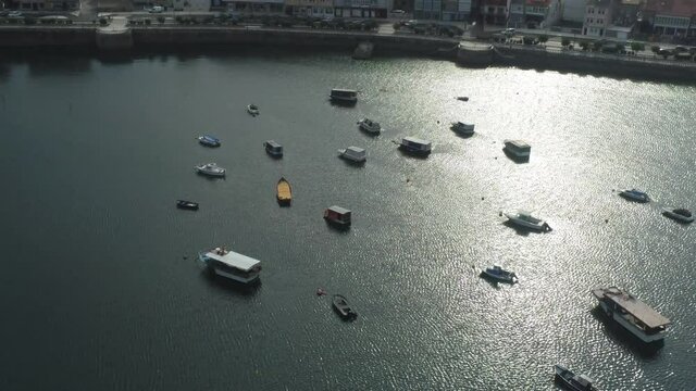 Boats moored in harbor. Spain. Aerial Drone Footage