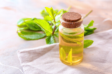 Mint essential oil on table