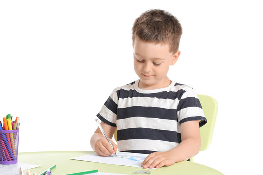 Cute little boy coloring pictures on white background