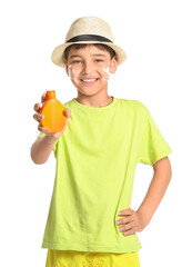 Little boy with sun protection cream on white background