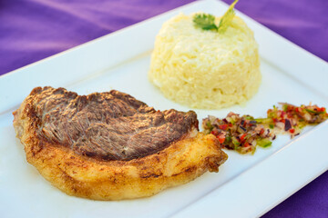 Piece of picanha meat roasted on the plate.