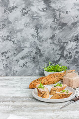 Turkey liver pate on whole grain baguette with microgreens