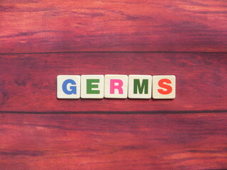 Word Germs on wood background