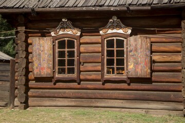 windows with shutters of a strin wooden house in the Russian style