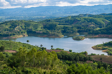 Fototapeta na wymiar Beautiful view of Mae Suai reservoir (or Dammed valleys) located at a narrow part of a valley downstream of a natural basin in Mae Suai district of Chiang Rai province of Thailand.