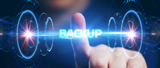 Business, Technology, Internet and network concept. Young businessman working on a virtual screen of the future and sees the inscription: Backup