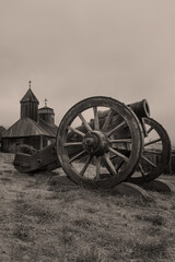 Fototapeta na wymiar Fort Ross canon and church. Fort Ross is a former Russian outpost in Sonoma County, California where 19th century Russians settled in