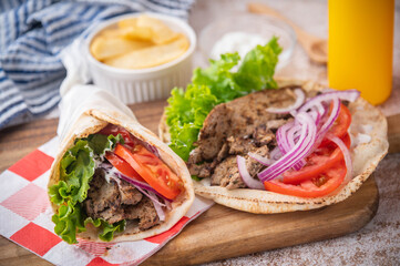 gyro wrap on wooden cutting board