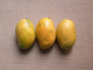 Yellow color whole ripe fresh Mallika mangoes