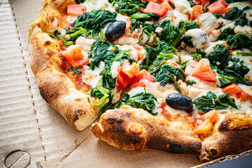 tasty pizza in the box