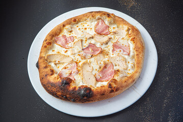 pizza on the black background, top view