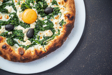 pizza on the black background, top view
