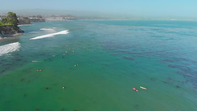 Surfers Waiting for Waves on Green Ocean with Kelp, Aerial