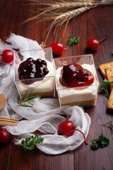 Strawberry cheese pie and Blueberry cheese pie on wooden table.