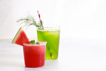 Red watermelon smoothie and green cocktail drink