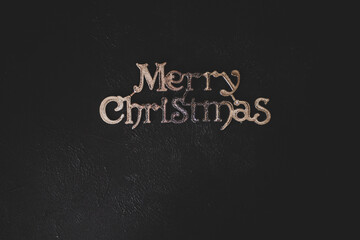 Merry Christmas lettering on a black background. Place for inscription 
