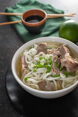  udon wheat noodles with boiled  offal and  broth. asian cuisine