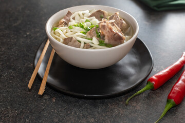 udon wheat noodles with boiled  offal and  broth.