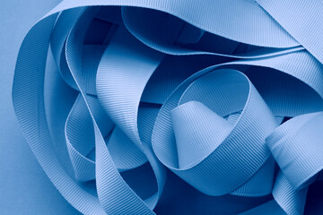 Texture of blue satin ribbon. Color light blue.
