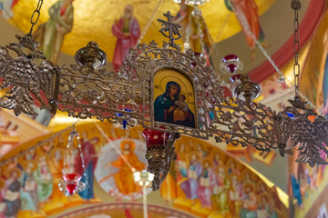 The icon depicting the Mother of God and Child on a large chandelier in the main hall of the Church of the Apostles not far from Tiberias city in northern Israel