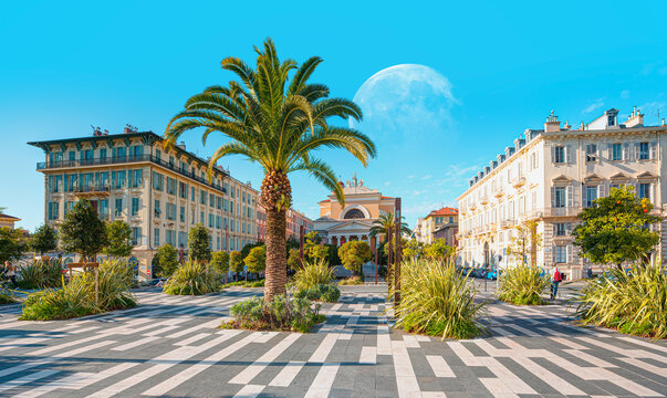 Architecture church of Eglise Saint Jean-Baptiste with Esplanade de la Bourgada park with full moon - Nice, France  "Elements of this image furnished by NASA"