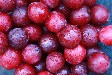 plums in drops of water on the table