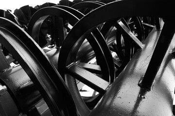 Modern cultivator for cultivating the land. Black and white image.