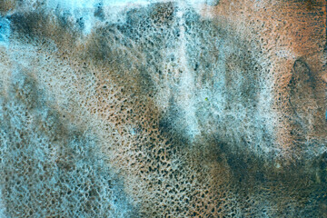 Copper-coloured rust natural texture on rough paper. Abstract background.