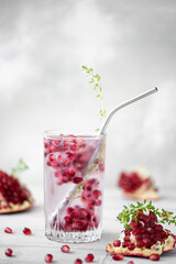 mineral water with frozen pomegranate seeds