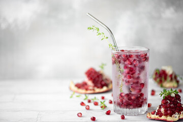 mineral water with frozen pomegranate seeds