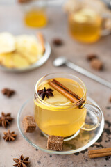 hot herbal tea with lemon, ginger and honey in glass mugs