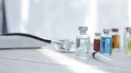 Vaccine bottles placed on the doctor's desk at the hospital.