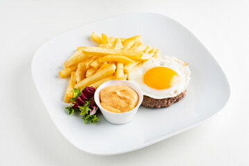 cutlet with egg and french fries